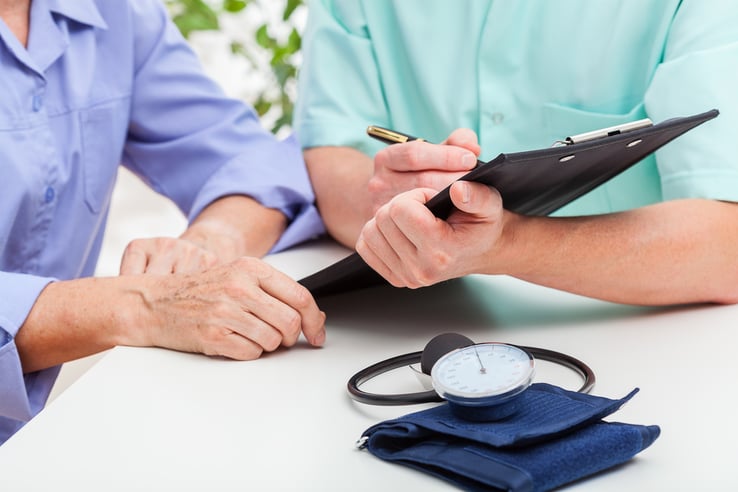 A doctor analyzing results of a pressure measuring